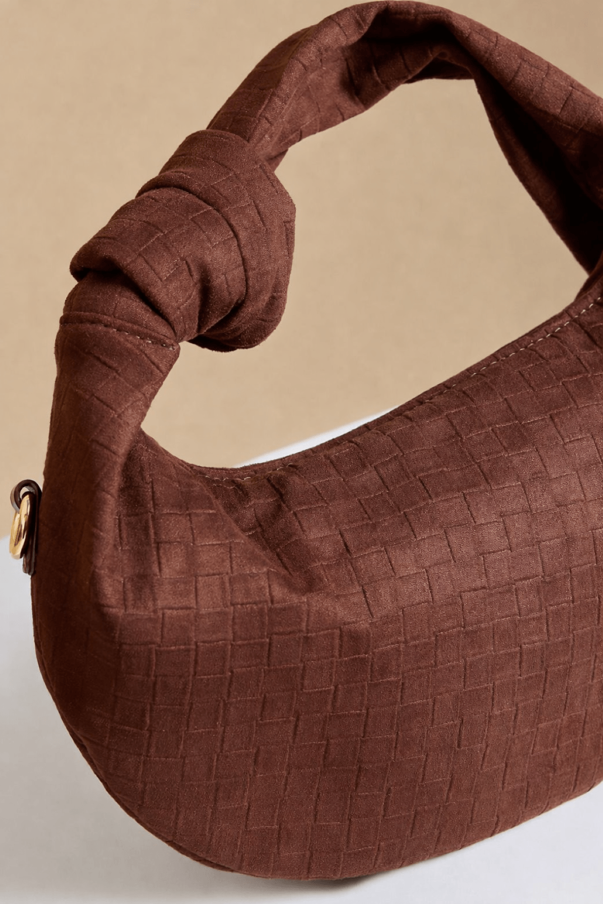 Chocolate Faux Suede Woven Emboss Grab Bag with knot handle and textured detail.