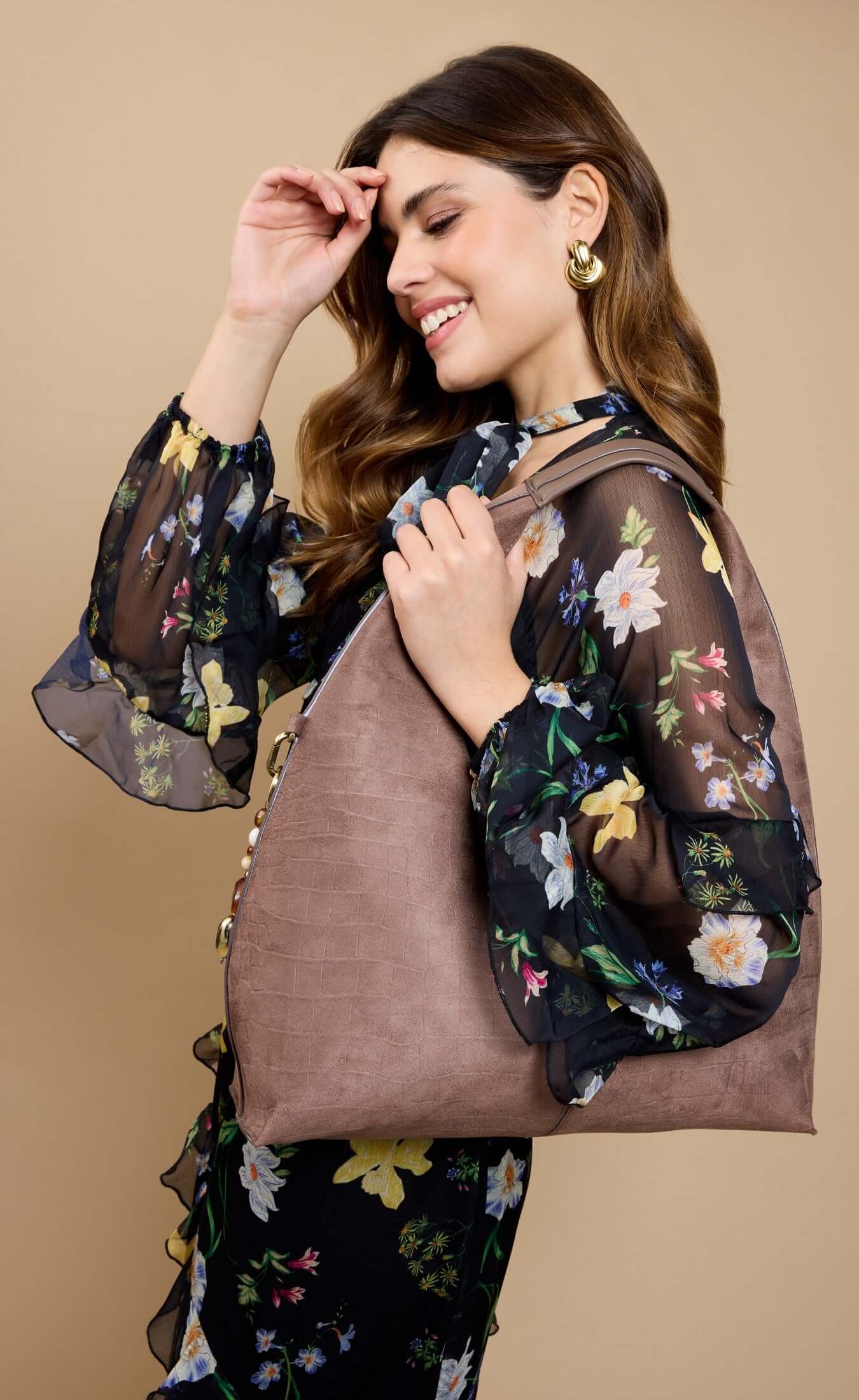 Mocha Croc Emboss Shoulder Bag worn by model in floral blouse, showcasing bead charm detail and casual style.