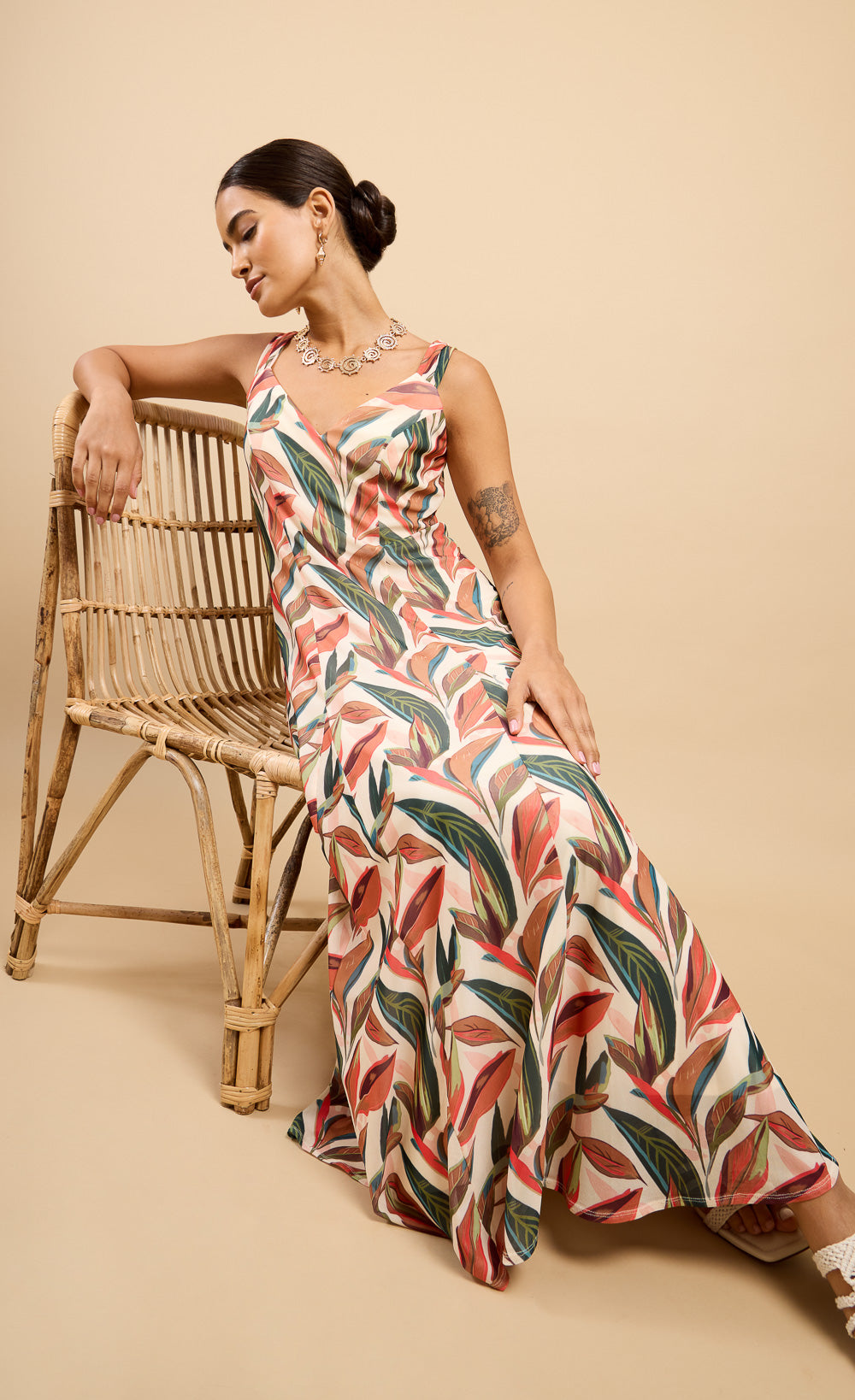 Model wearing Carlotta Leaf Print Maxi Dress Vicky Pattison EDIT, showcasing a flowing a-line silhouette and vibrant leaf print.