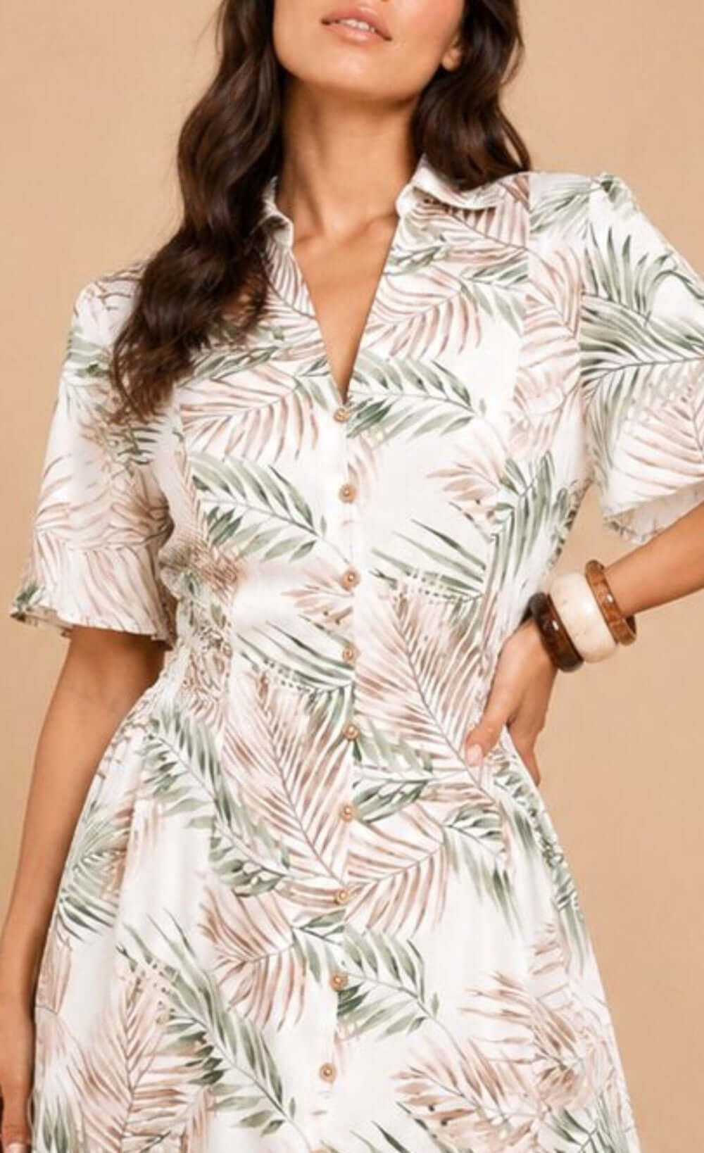 Trendy chic UK woman in palm print midi dress with button-down front, relaxed fit, perfect for warm-weather occasions. Ref: D36083R1A.