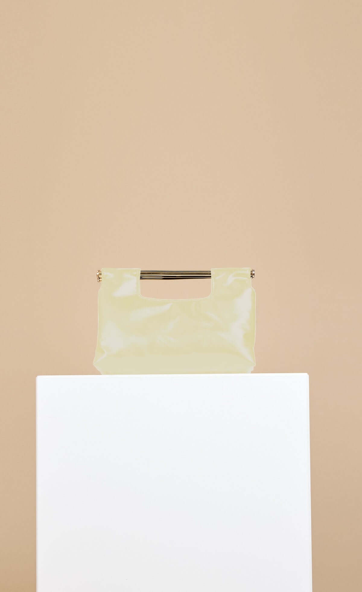 Yellow Metal Bar Clutch Bag featuring soft faux leather and chain shoulder strap detail
