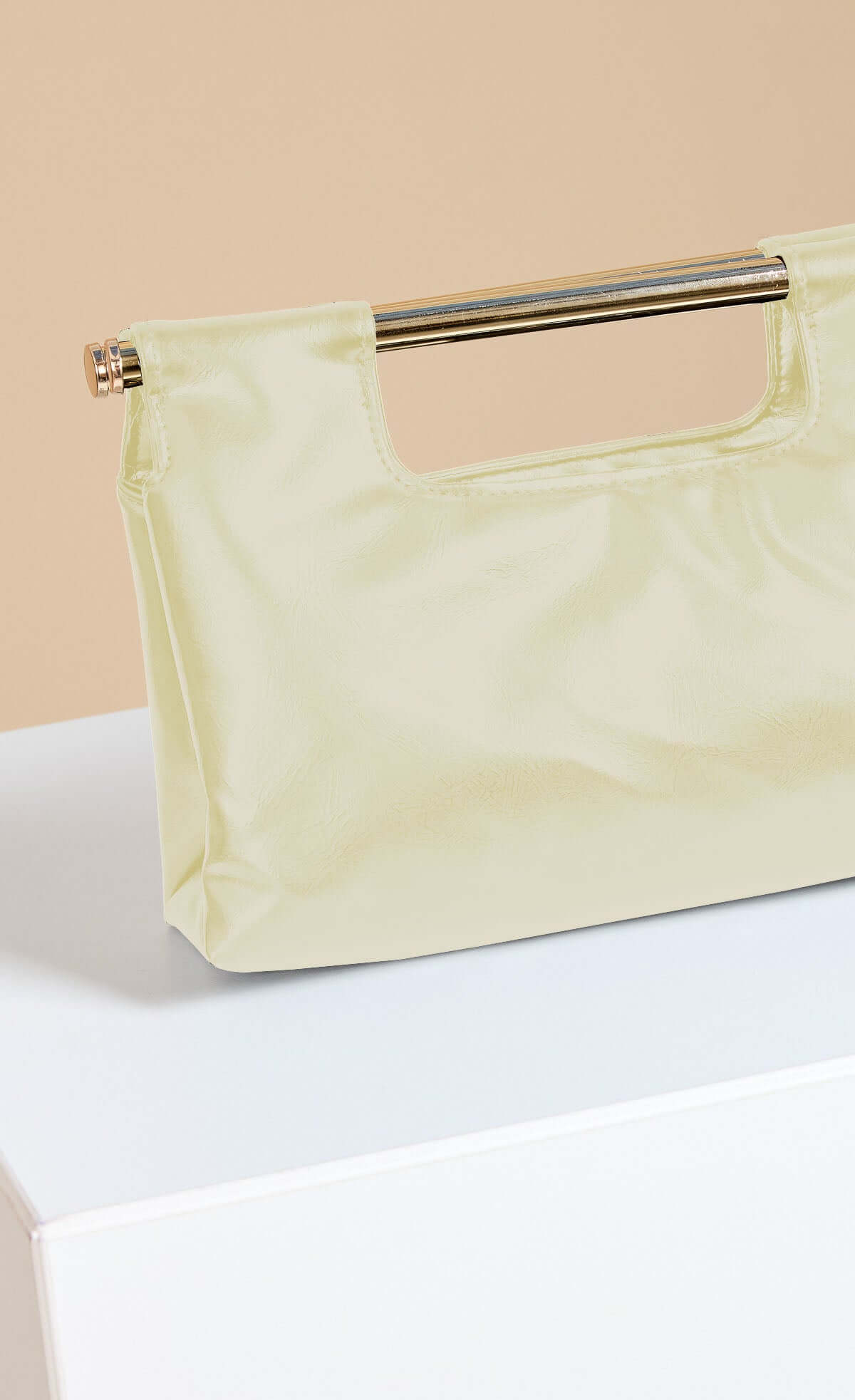 Yellow Metal Bar Clutch Bag in soft faux leather with chain shoulder strap and metal handle.