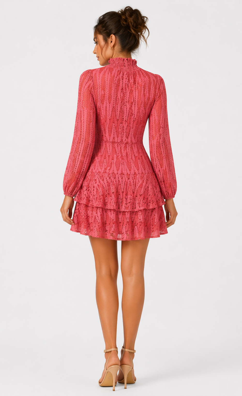 Back view of a trendy coral lace high neck mini dress with long sleeves and a tiered skirt.