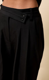 Noelle Black Trousers featuring a high waist and wide leg design for comfort and style.