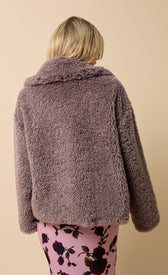 Back view of a stylish mink faux fur jacket with a turn-down collar, perfect for winter layering.