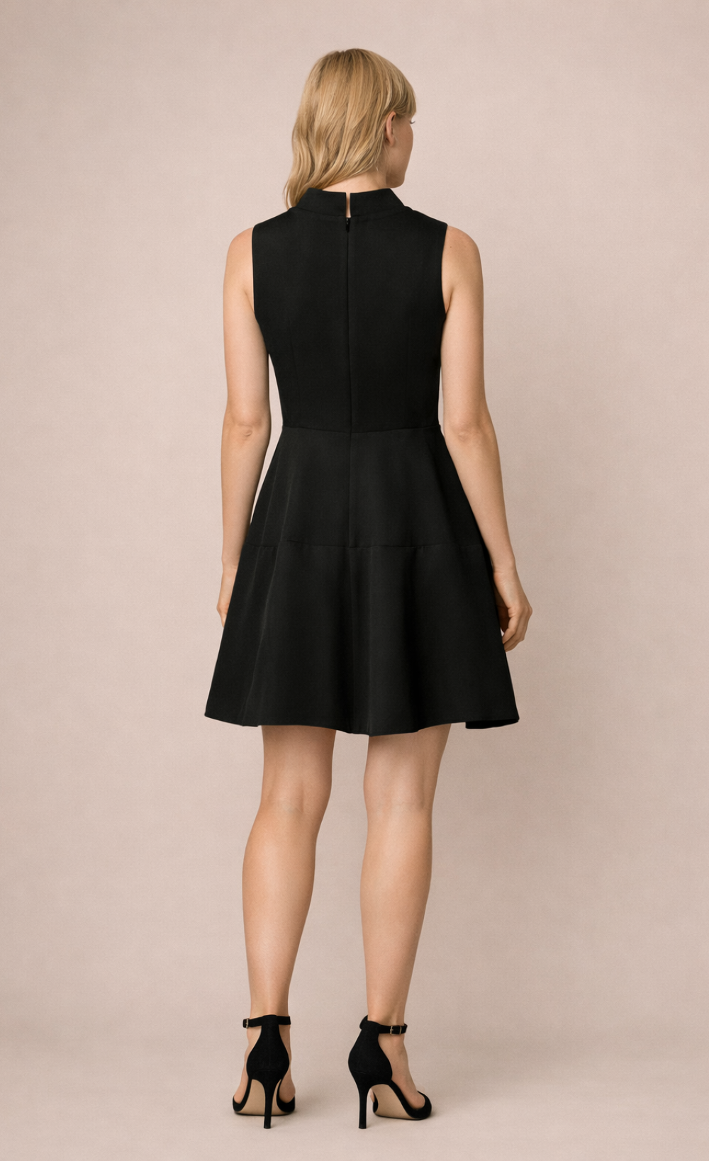 Black Twist Neck Mini Dress showcasing the back design, elegant silhouette, and flared skirt detail.