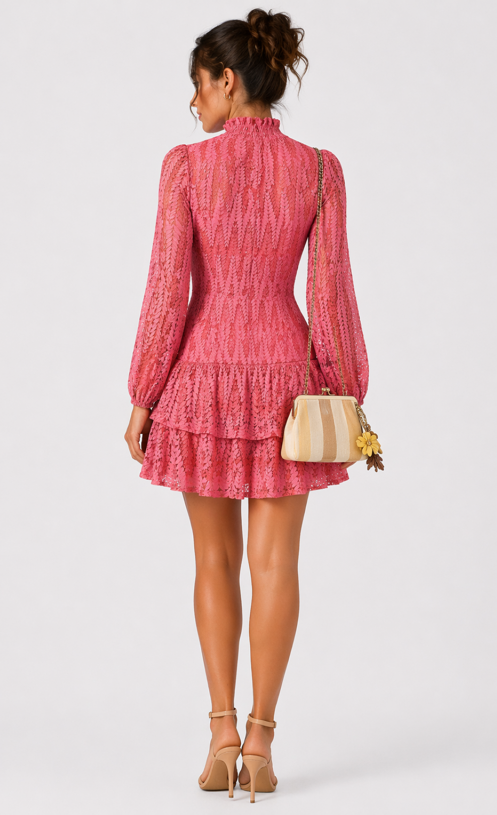 Coral lace high neck mini dress featured on a trendy chic UK woman, showcasing an elegant design and tiered skirt.