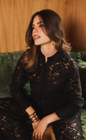 Model wearing Micaela Black Lace Shirt featuring a turn-down collar and long sleeves, exuding elegance.